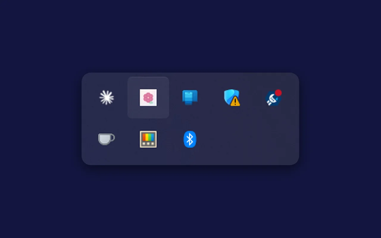 The Windows system-tray overflow menu with Bloom's flower icon highlighted among other tray apps