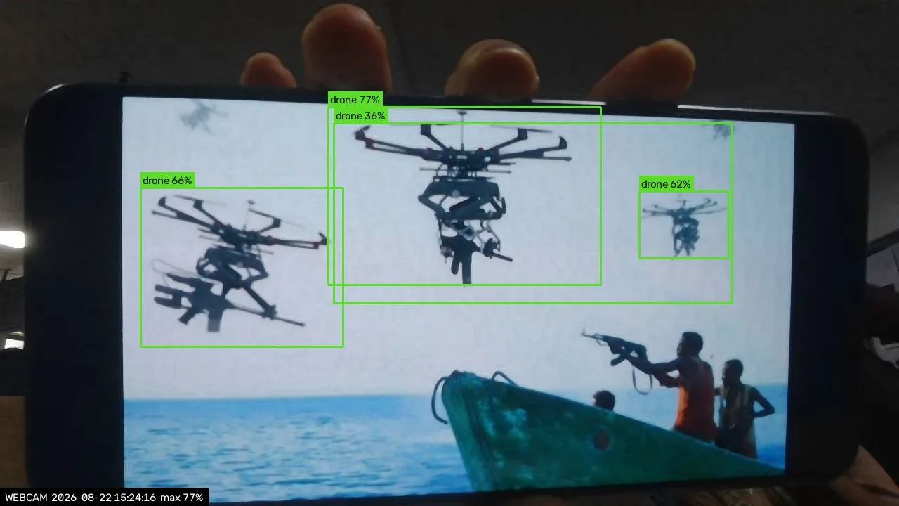 SkyGuard picking out three armed drones at once from a video on a phone held up to the webcam, at 36 to 77% confidence