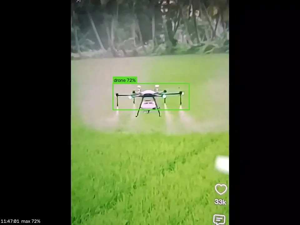 SkyGuard webcam view flagging a crop-spraying quadcopter over a paddy field as a drone at 72% confidence